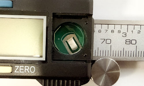 Open battery compartment of a digital caliper